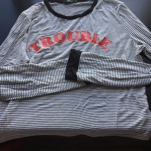 black and white long sleeve "trouble" red writing